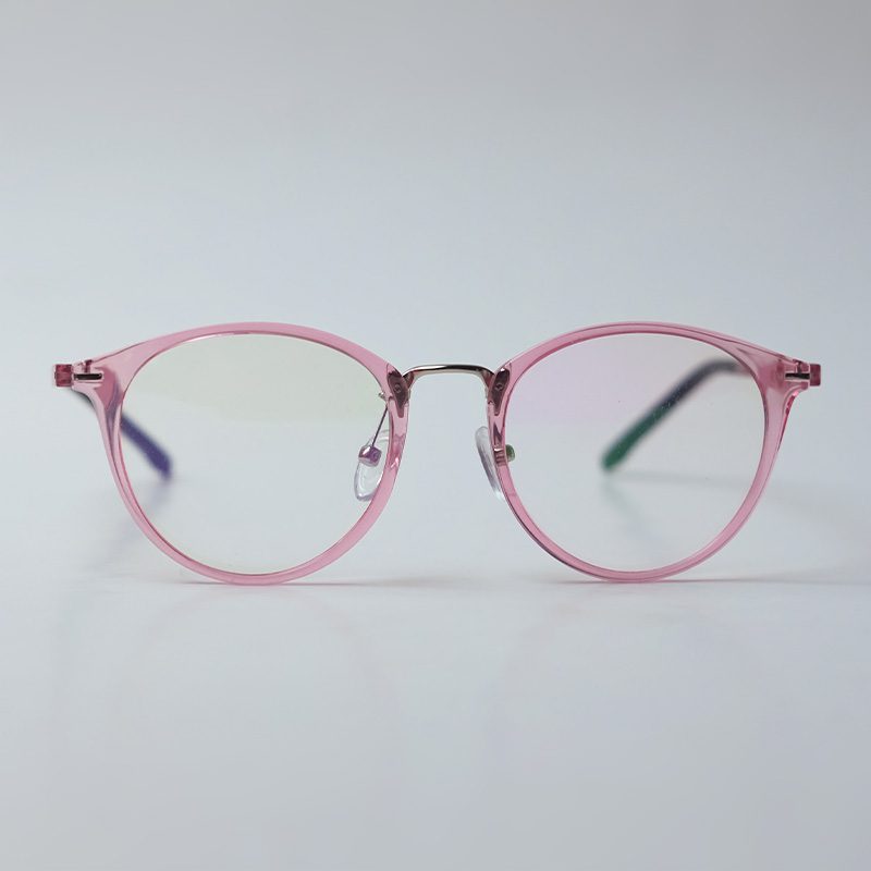 Round translucent rose pink eyeglasses on a light grey backdrop