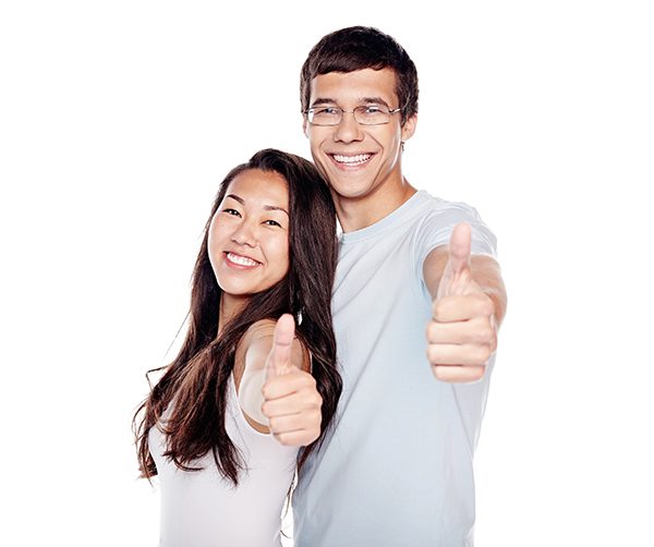 A smiling man and woman hold out their arms with the thumbs up sign